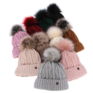 Woman's winter hat camel Renika with pompom