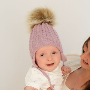 Girl's winter set: hat and tube scarf beige Klementin with pompom