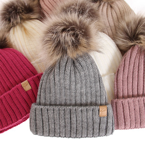 Woman's winter hat beige Europa with pompom