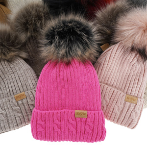 Woman's winter hat beige Lawina with pompom